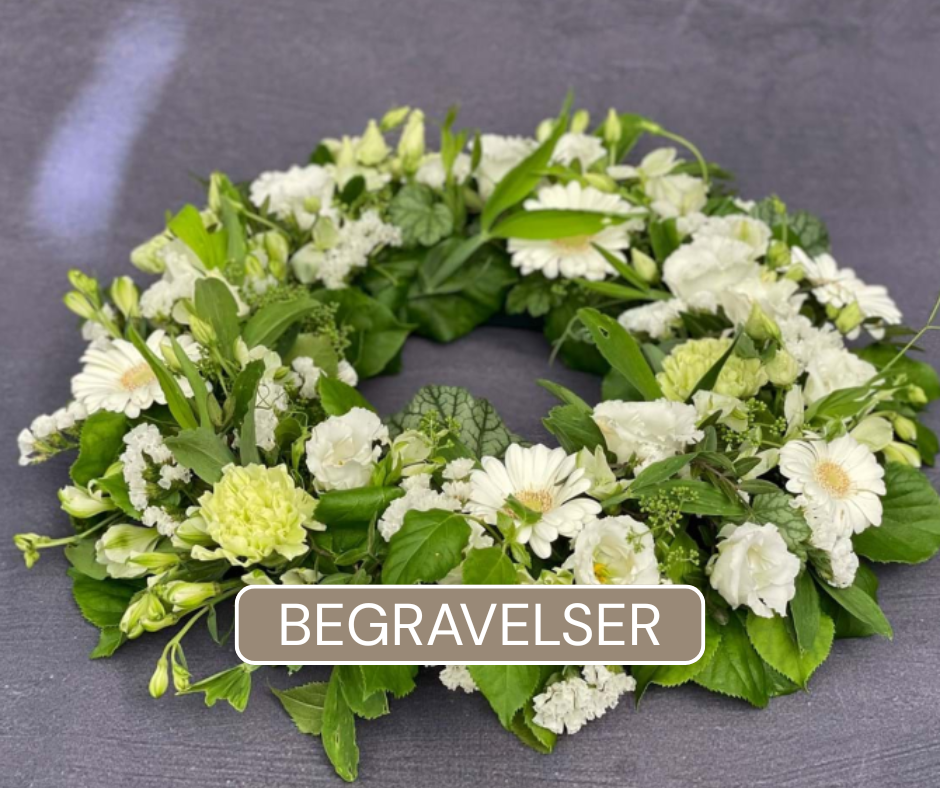 Begravelseskrans bundet med hvide blomster. 